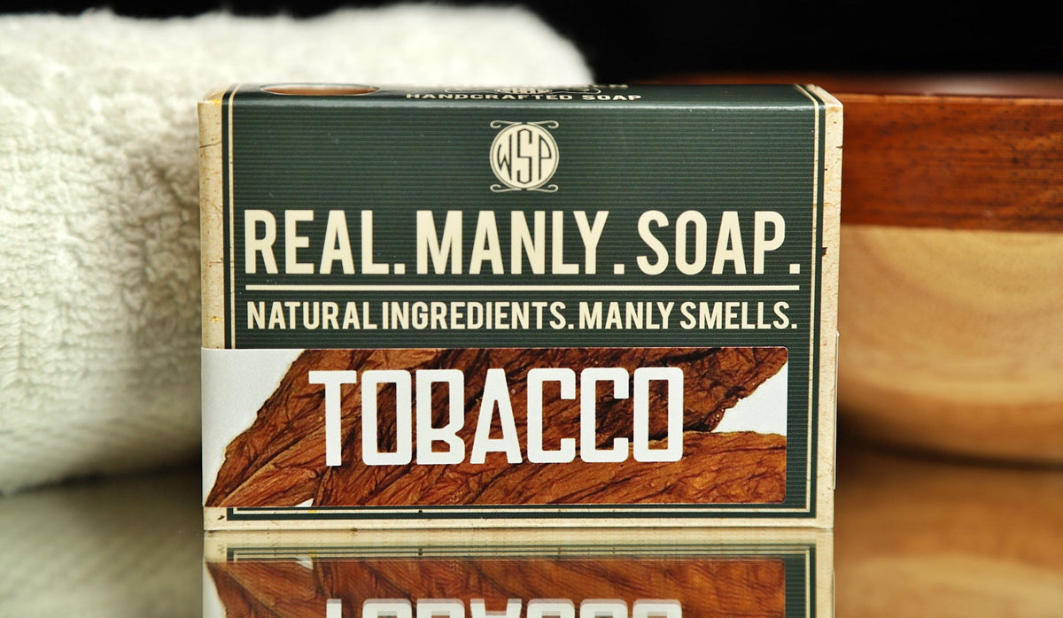 WSP Bar Soap Tobacco scent with a towel and bowl in the background.