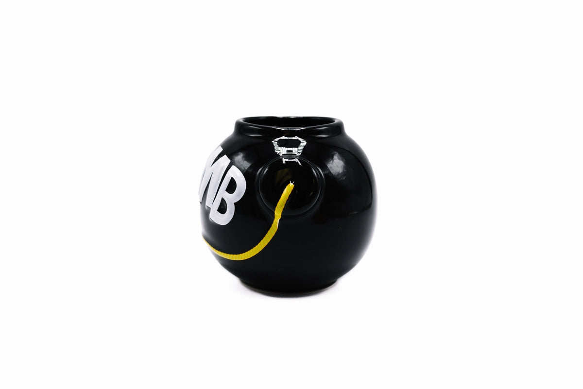 Side view of F-Bomb ceramic mug showing bomb-shaped design and handle