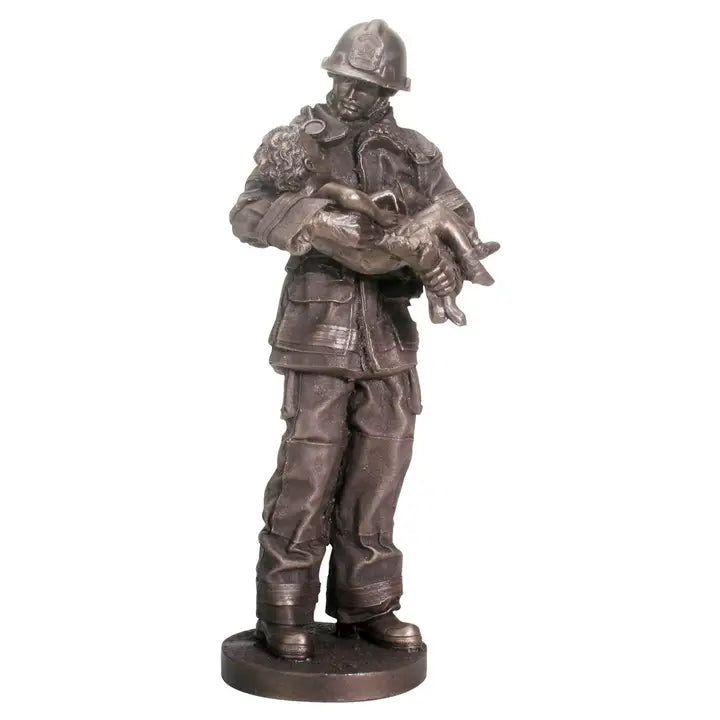 Firefighter holding child statue made from cold cast resin with bronze-tone finish.