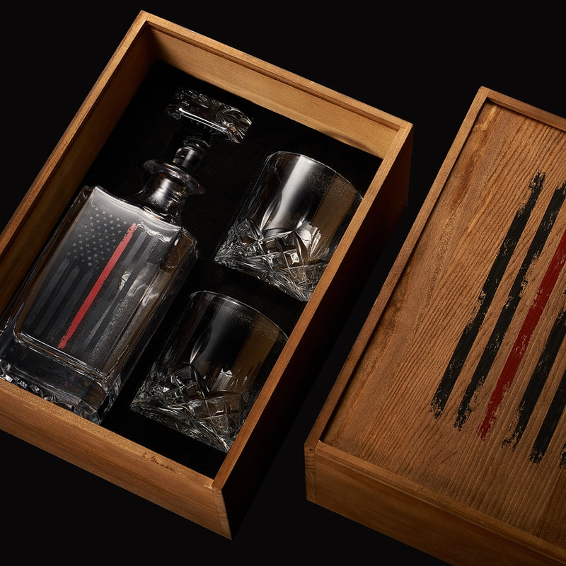 Close-up of firefighter whiskey decanter featuring a red American flag design on glass.