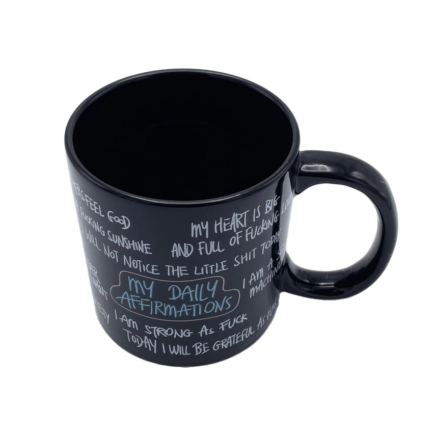 Side profile of the giant 22 oz funny affirmation coffee mug with oversized handle and black ceramic finish.