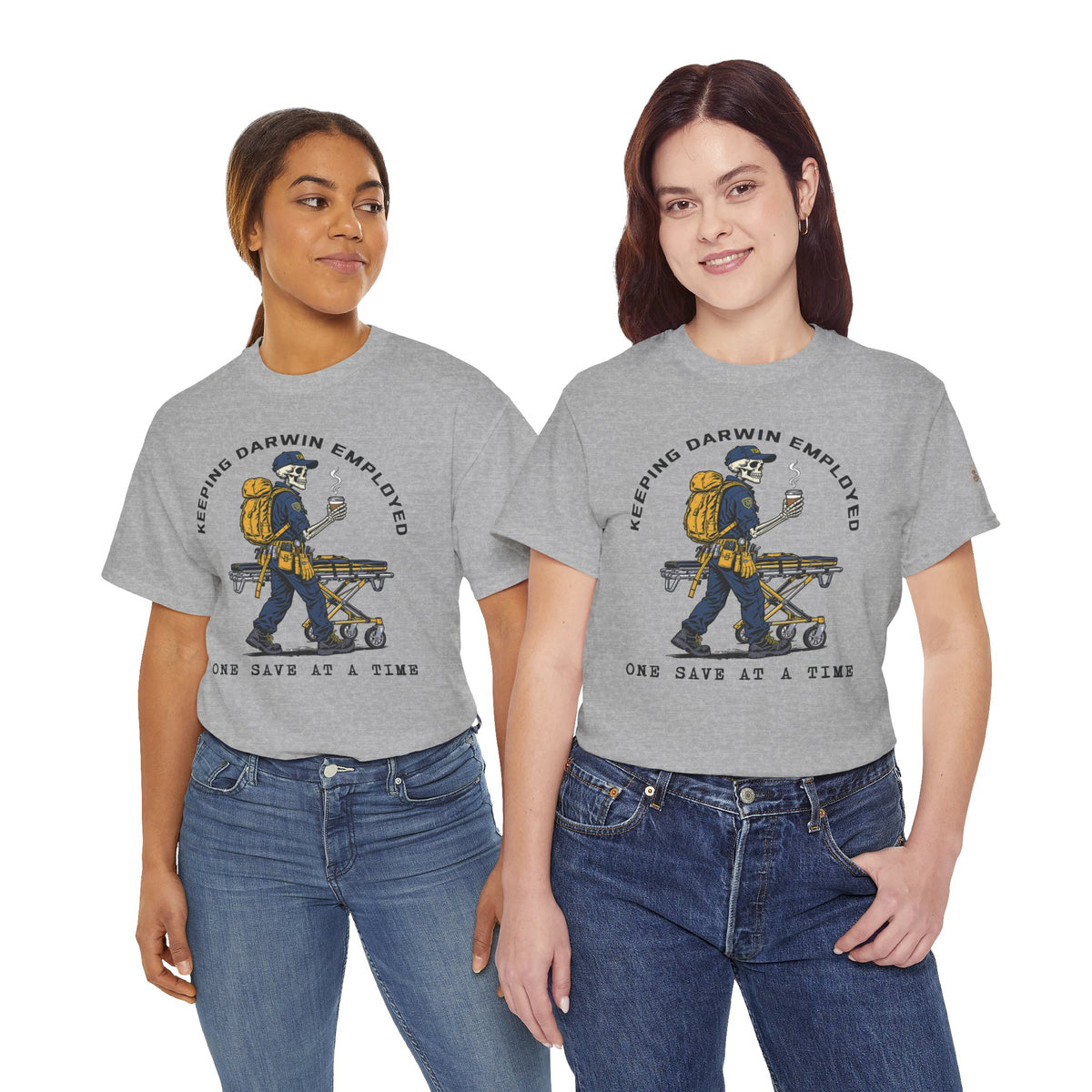 Two models wearing gray Keeping Darwin Employed EMS graphic T-shirts with skeleton paramedic artwork