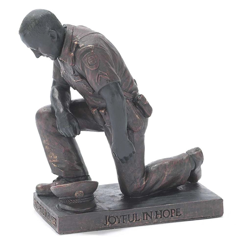 Kneeling police officer prayer figurine with bronze finish and engraved scripture.