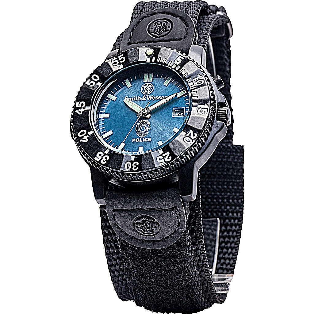 Smith & Wesson police watch with blue dial, luminous hands, Japanese quartz movement, rotating bezel, and black nylon strap.