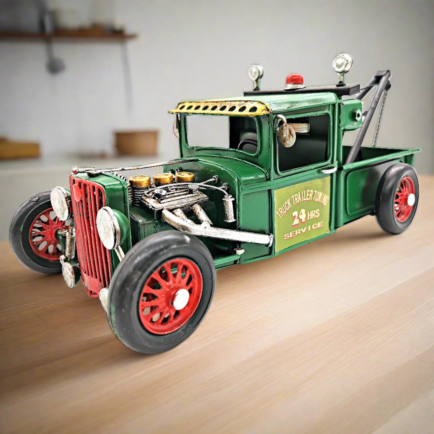 Handcrafted vintage metal towing truck model with rustic industrial desk and office decor design.